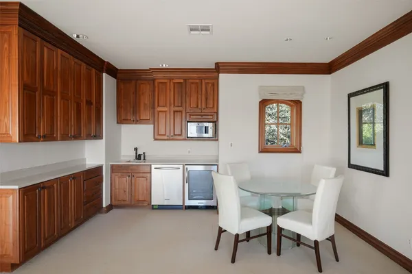 a view of a kitchen with granite countertop furniture a sink and a window