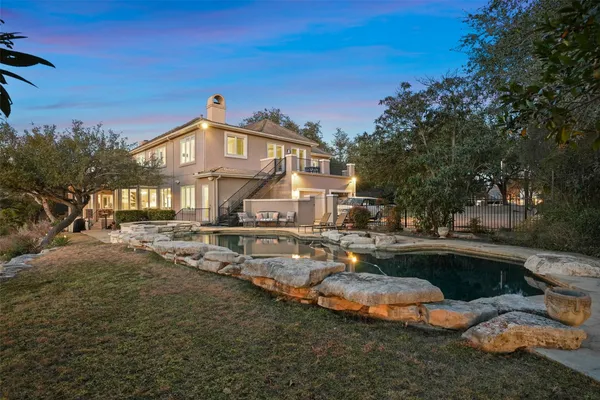 a front view of a house with swimming pool