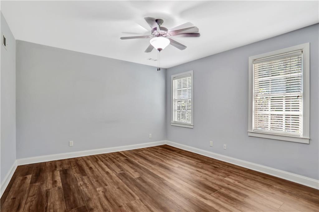 2444 Oak Grove Heights Decatur, GA 30033 - Photo 24 of 26 a view of an empty room with wooden floor and a window