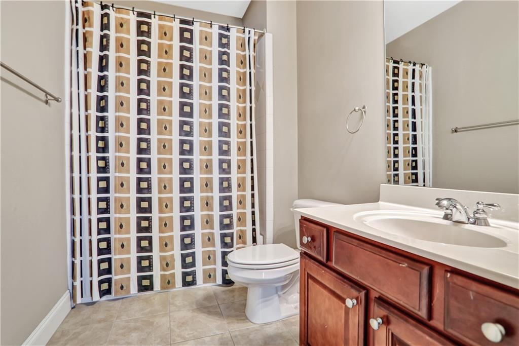2444 Oak Grove Heights Decatur, GA 30033 - Photo 25 of 26 a bathroom with a sink a toilet and shower curtain