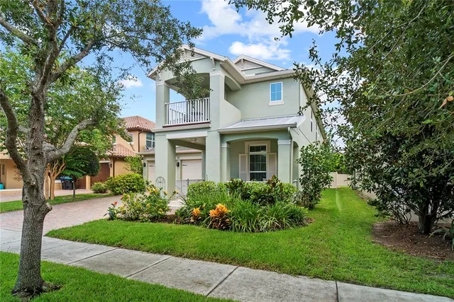 a front view of a house with a garden