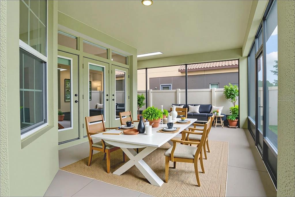 11922 Angle Pond Avenue Windermere, FL 34786 - Photo 34 of 45 a dining room with furniture and a floor to ceiling window