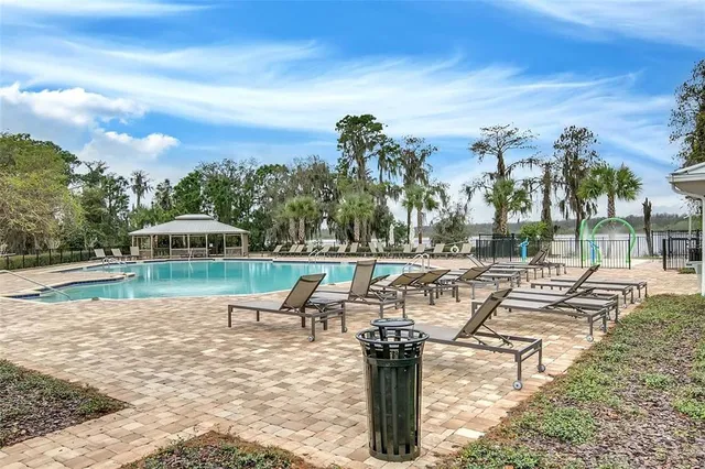 a view of a swimming pool with a patio