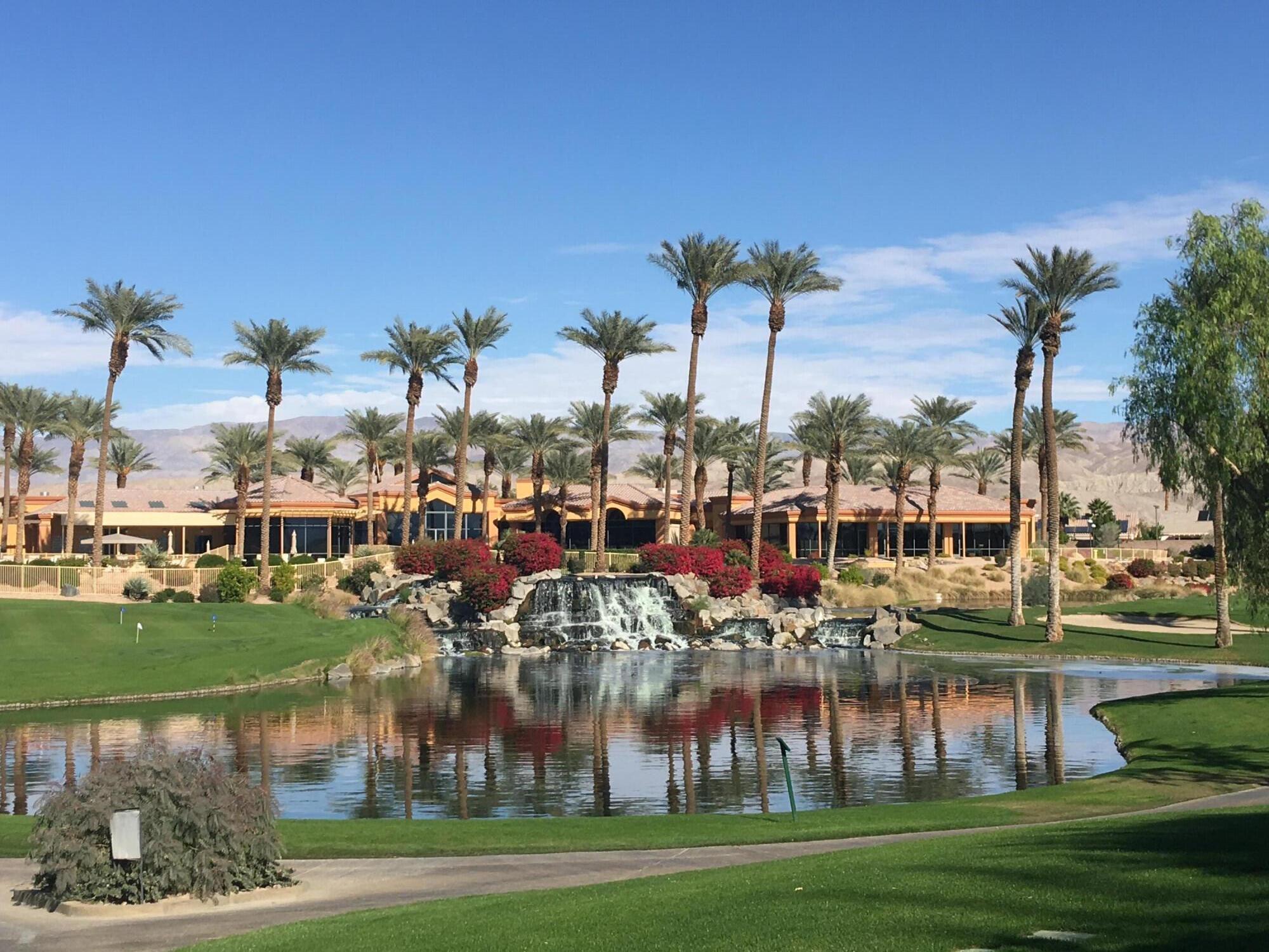 78376 Moongold Road Palm Desert, CA 92211 - Photo 22 of 36 a view of a lake with a big yard and palm trees