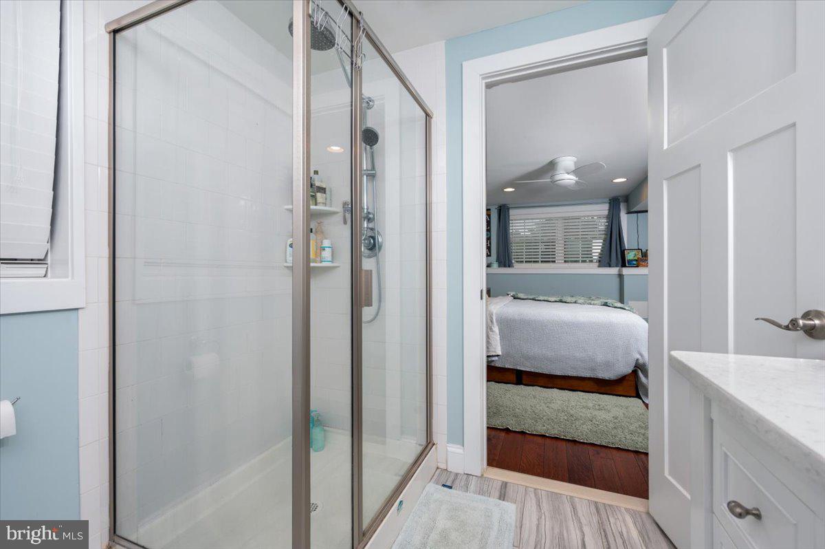57 Spa Road Annapolis, MD 21401 - Photo 24 of 39 a en suite bathroom with a tub shower and mirror
