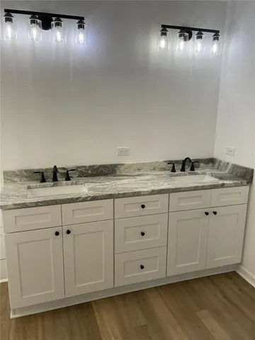 a view of a kitchen with granite countertop cabinets and sink