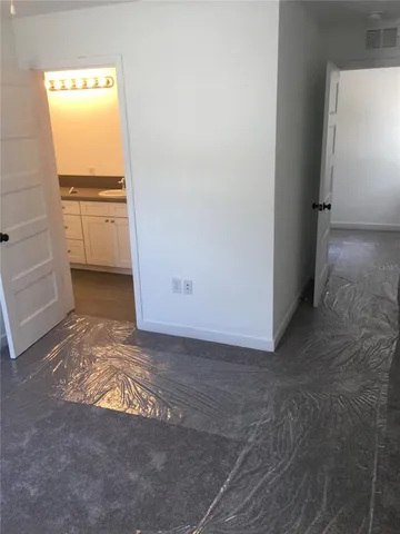 a view of an empty room with a window