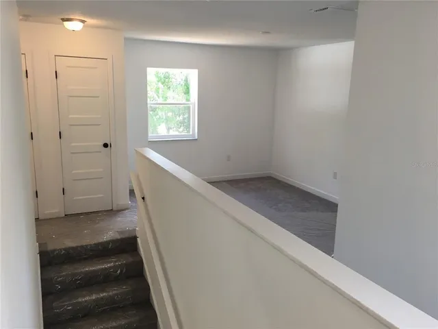 a view of hallway with stairs