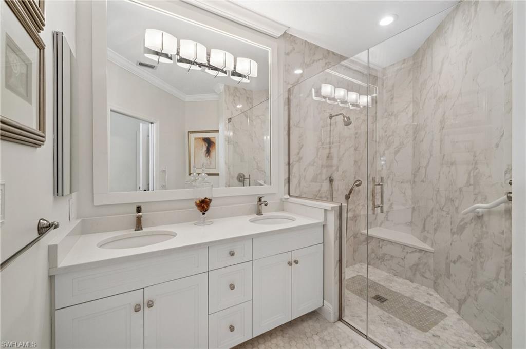 13180 Hamilton Harbour Drive, Unit E1 Naples, FL 34110 - Photo 18 of 30 Renovated Bathrooms using high-end materials.