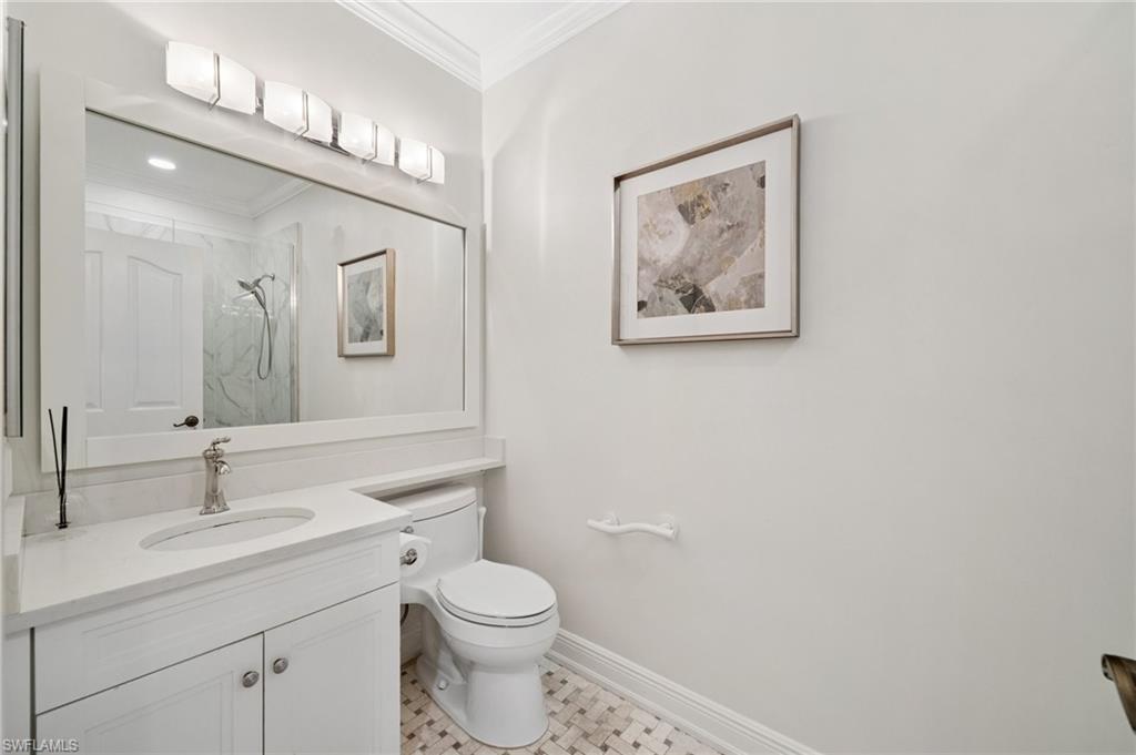 13180 Hamilton Harbour Drive, Unit E1 Naples, FL 34110 - Photo 21 of 30 Renovated bathrooms, showcasing a polished and modern design with updated fixtures and finishes.