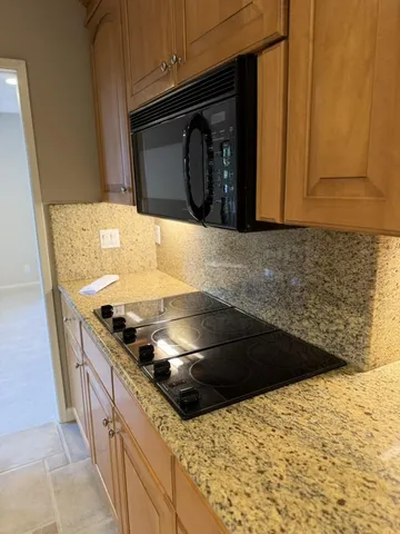 a bedroom with a large bed and a large window