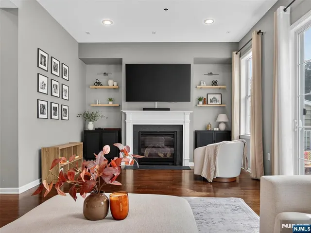 a living room with furniture fireplace and a flat screen tv
