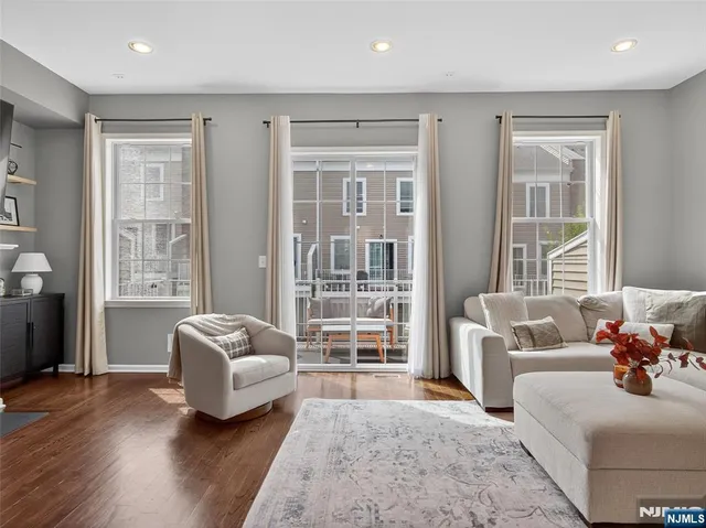 a balcony with furniture and a rug