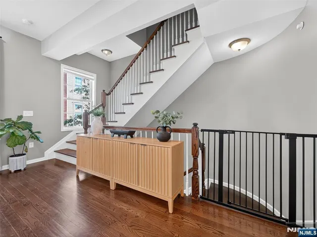 a view of a livingroom with furniture and wooden floor