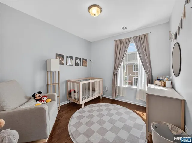 a front view of a house with a garden and plants