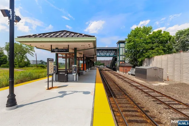 a view of a park with swings and slides