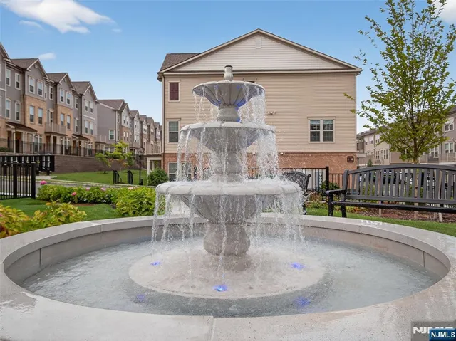 a view of a tennis ground with a pool