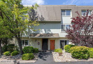 3905 Covington Way, Unit A Reno, NV 89503 - Photo 1 of 28 a view of a house with brick walls and potted plants
