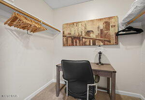 3905 Covington Way, Unit A Reno, NV 89503 - Photo 11 of 28 a workspace with a chair and a wall painting