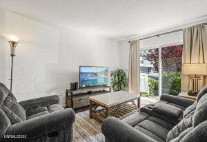 3905 Covington Way, Unit A Reno, NV 89503 - Photo 2 of 28 a living room with furniture and a flat screen tv