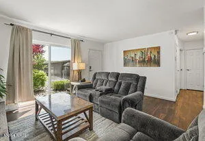 a living room with furniture and a large window