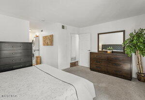 3905 Covington Way, Unit A Reno, NV 89503 - Photo 8 of 28 a bedroom with a bed and a dresser