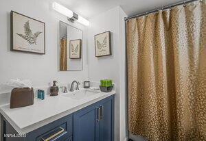 3905 Covington Way, Unit A Reno, NV 89503 - Photo 10 of 28 a bathroom with a sink and a mirror