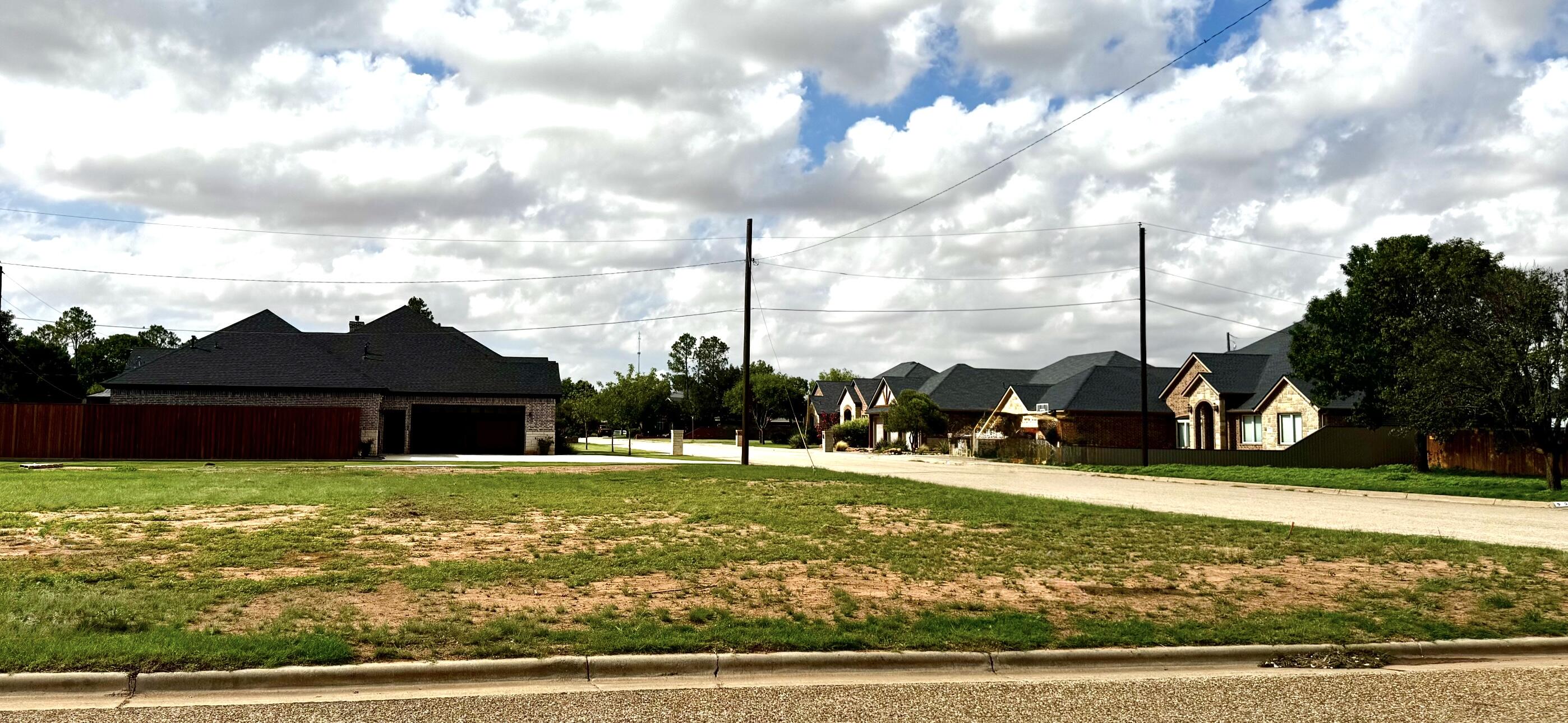 a view of a house with a big yard