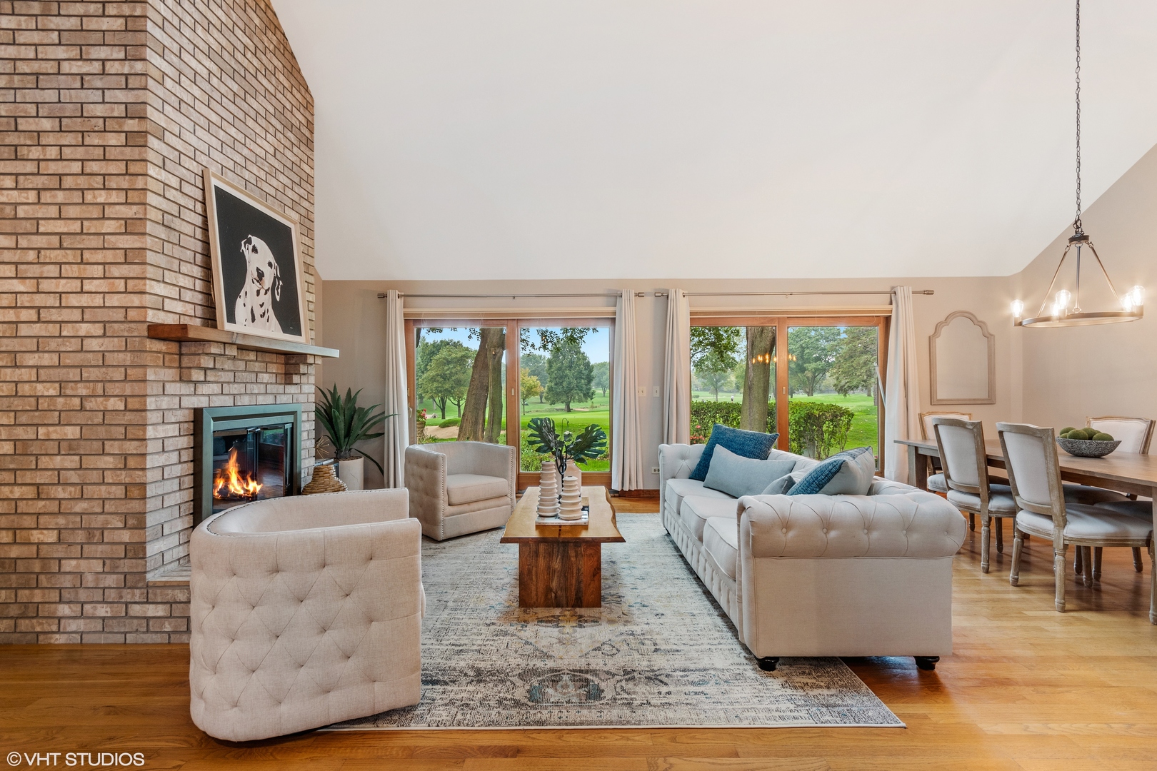 714 Natwill Square Geneva, IL 60134 - Photo 3 of 27 a living room with furniture fireplace and a large window