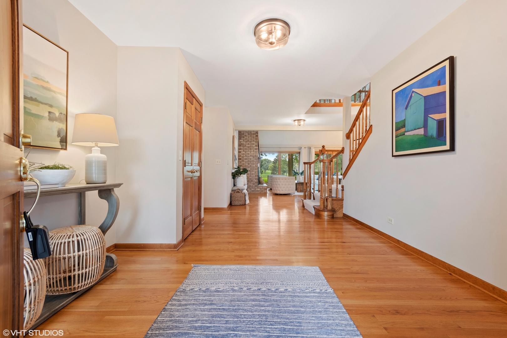 714 Natwill Square Geneva, IL 60134 - Photo 4 of 27 a view of an entryway with wooden floor