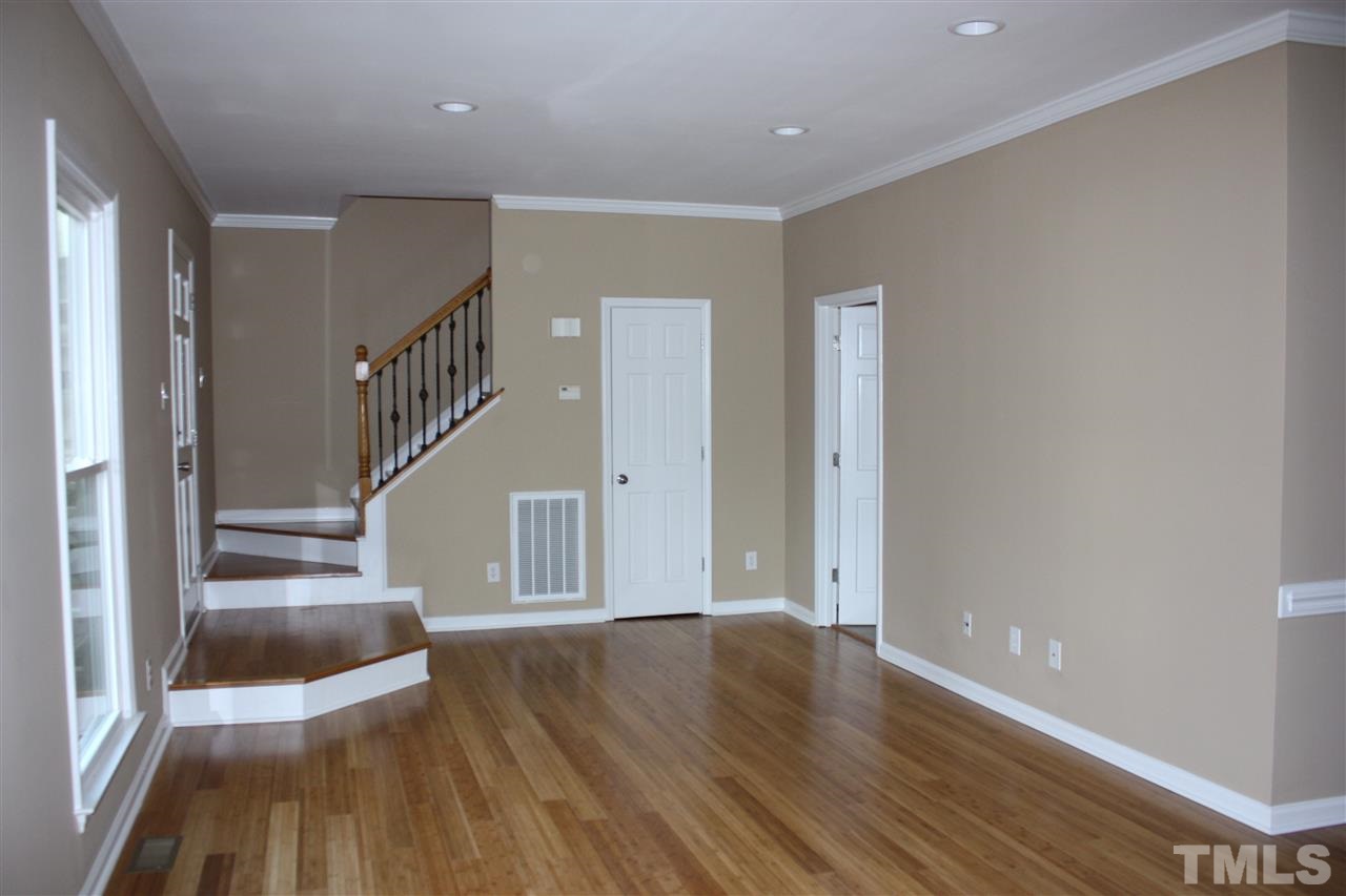 108 Ridgepath Way Cary, NC 27511 - Photo 12 of 20 a view of entryway and hall with wooden floor