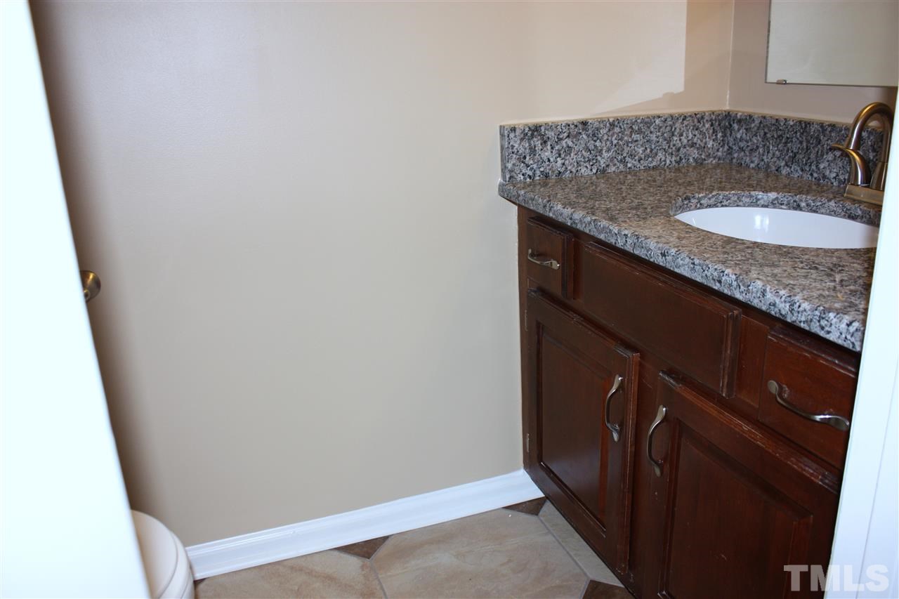 108 Ridgepath Way Cary, NC 27511 - Photo 16 of 20 a bathroom with a granite countertop sink and vanity