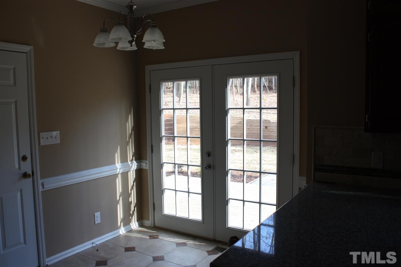 108 Ridgepath Way Cary, NC 27511 - Photo 17 of 20 wooden floor in an empty room with a window