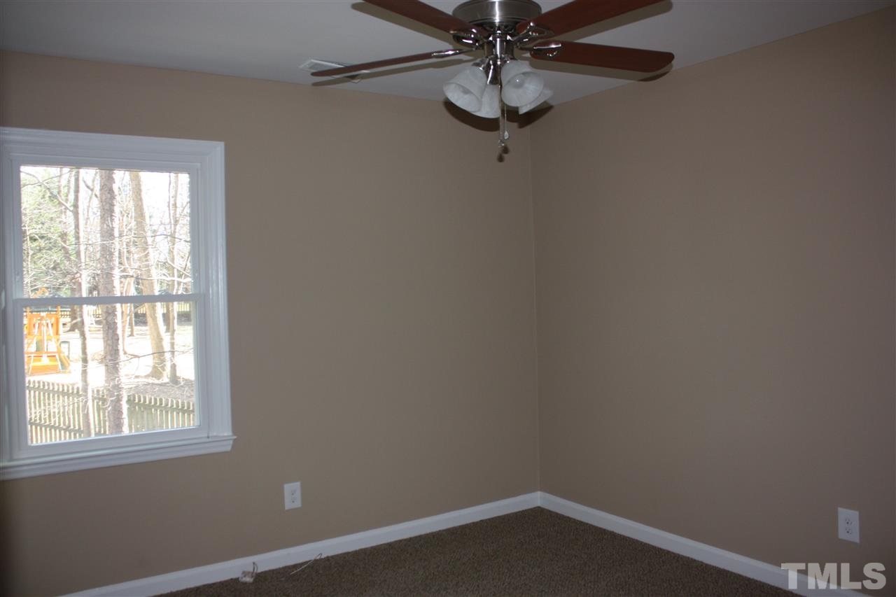 108 Ridgepath Way Cary, NC 27511 - Photo 7 of 20 an empty room with a window