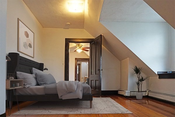 159 Brown Street, Unit 3 Waltham, MA 02453 - Photo 4 of 10 a living room with furniture and a rug