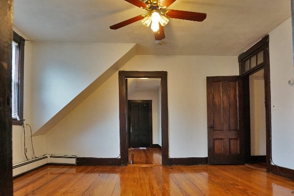 159 Brown Street, Unit 3 Waltham, MA 02453 - Photo 7 of 10 a view of empty room with wooden floor