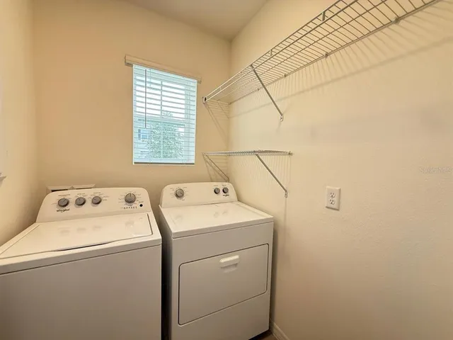 a utility room with dryer and washer