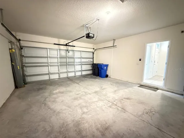 a view of a garage room and garage