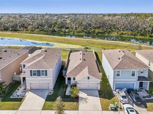 an aerial view of a house with a outdoor space