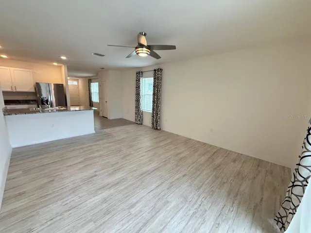 a view of a kitchen with a sink and a window