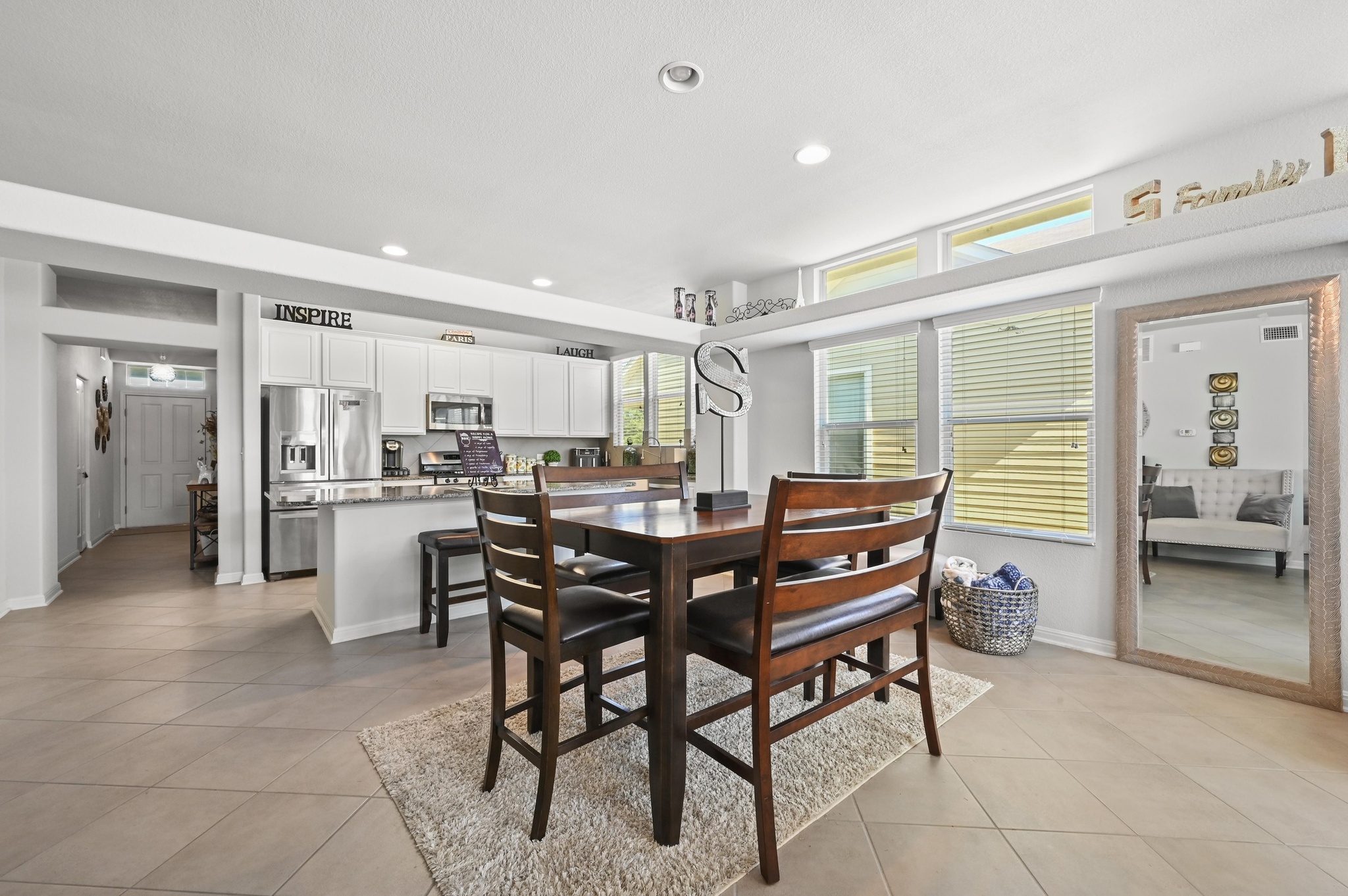 1480 Sanders Kyle, TX 78640 - Photo 11 of 27 The centrally located dining area is bright and spacious with ample room for a sizable dining table alongside generous windows.