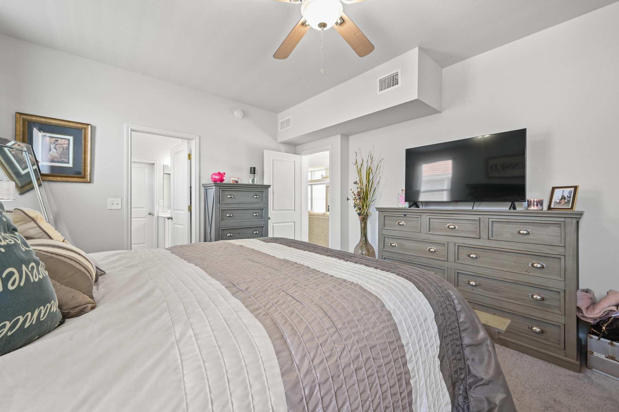 1480 Sanders Kyle, TX 78640 - Photo 13 of 27 The primary suite is a secluded retreat with its own ensuite bath and walk-in closet.