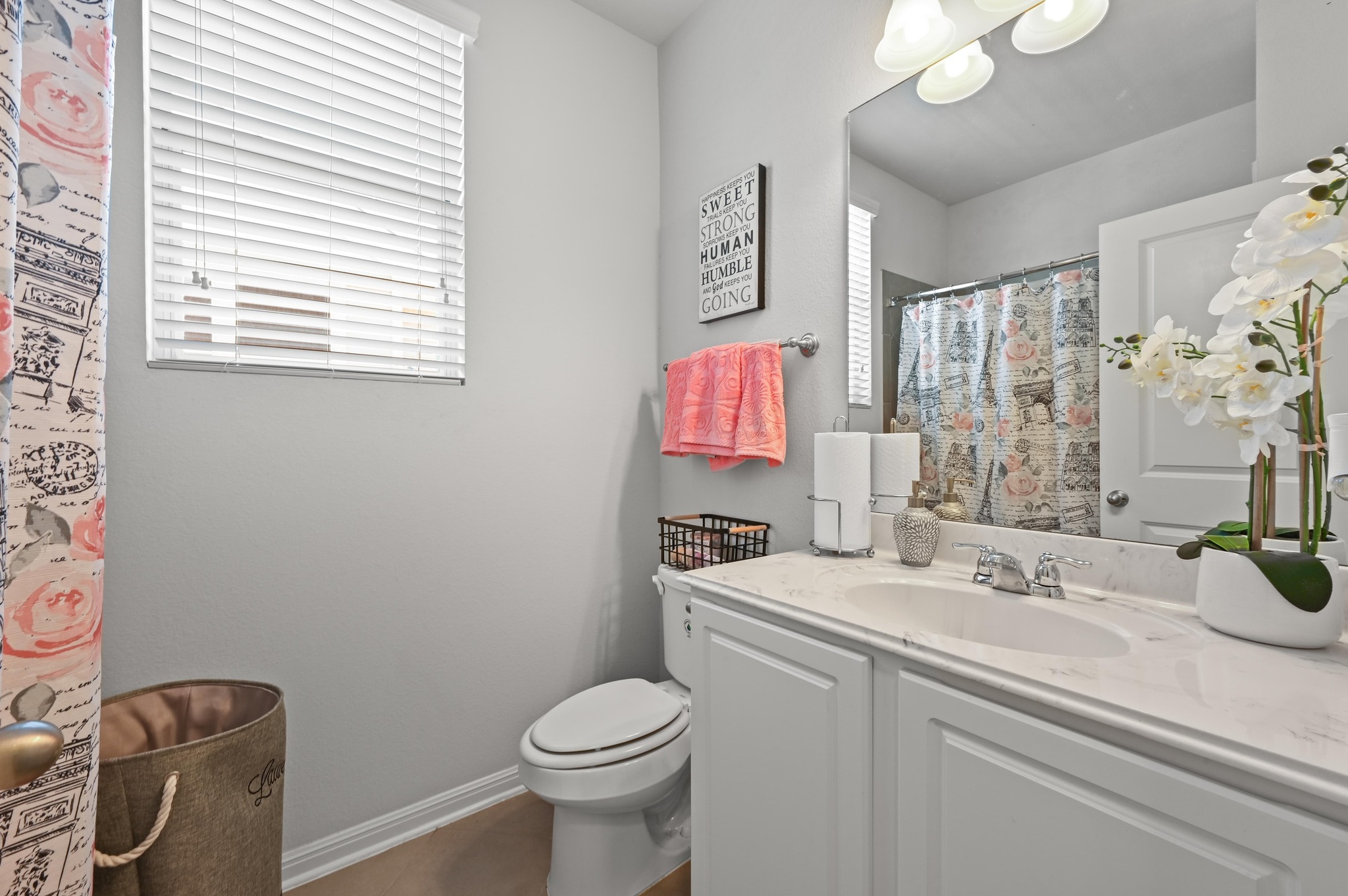 1480 Sanders Kyle, TX 78640 - Photo 21 of 27 The full secondary bath comes with a single vanity, shower/tub combo, and charming window for natural light and fresh air.