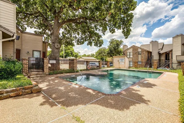 a view of a patio with swimming pool