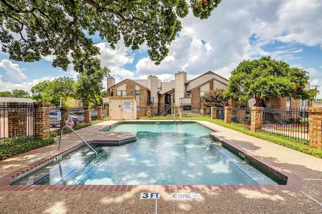 a view of a house with swimming pool and sitting area