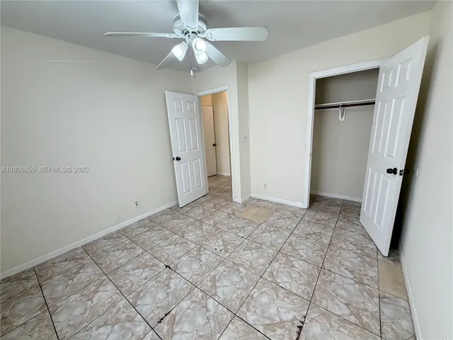 a view of closet with wooden floor