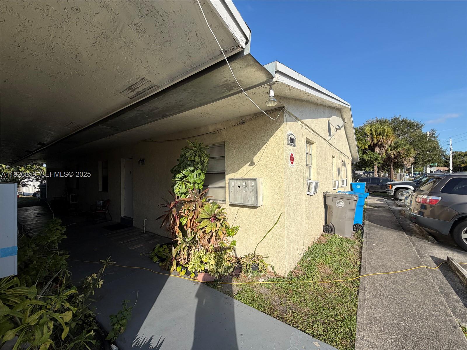 4801 Southwest 18th Street, Unit 3 West Park, FL 33023 - Photo 21 of 22 a view of a street with cars parked