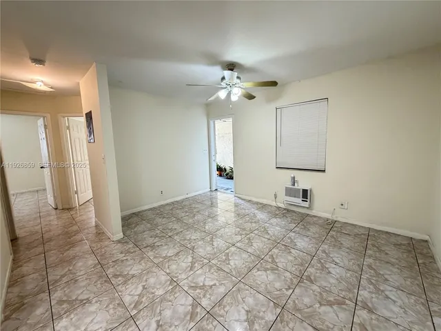 a view of a kitchen with cabinet and a chandelier fan