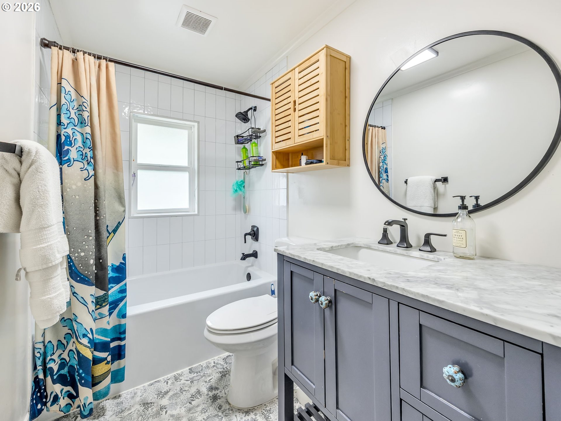 933 8th Street Astoria, OR 97103 - Photo 20 of 31 a bathroom with a granite countertop sink and a mirror