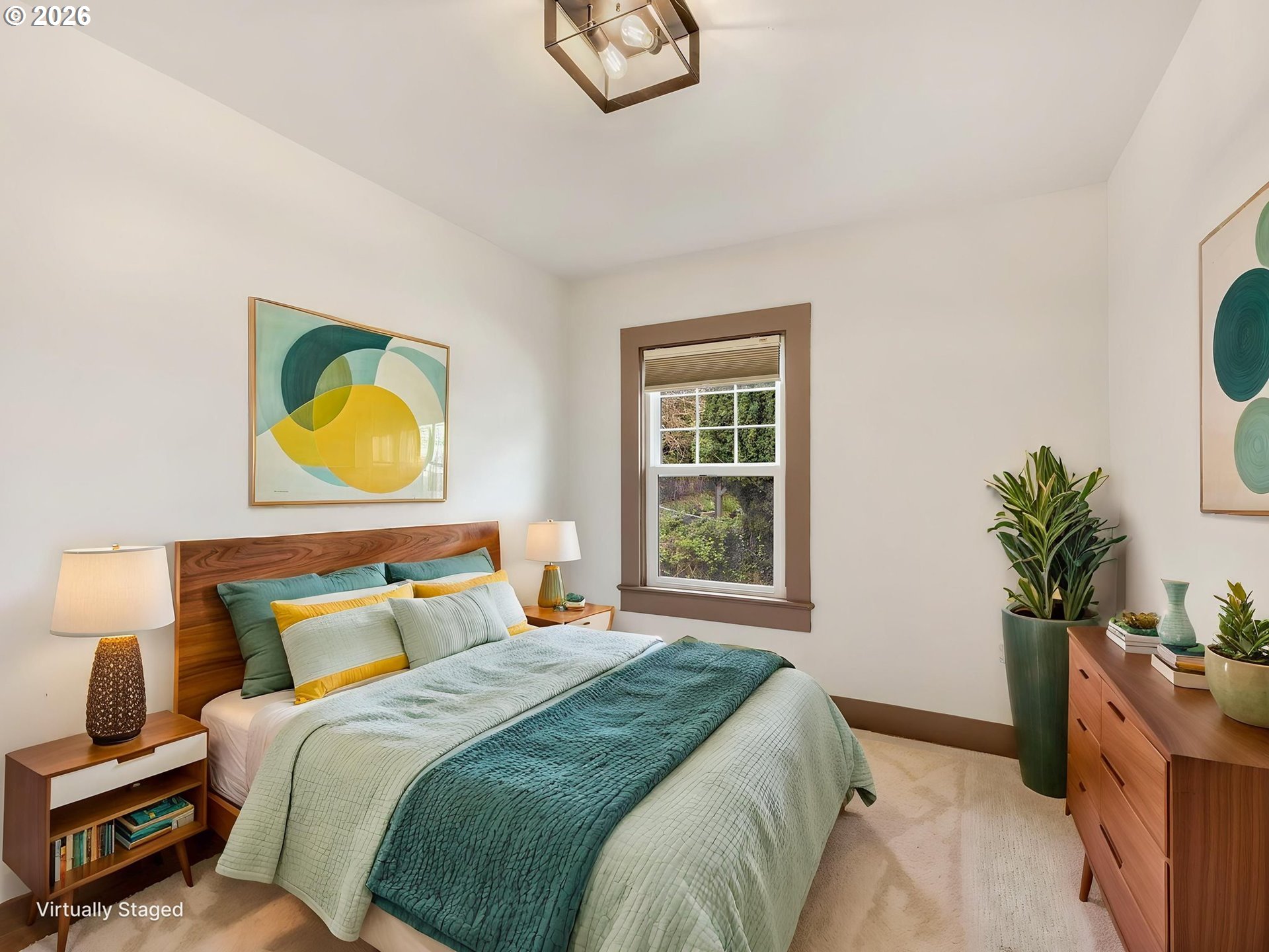 933 8th Street Astoria, OR 97103 - Photo 21 of 31 a bedroom with a bed and a potted plant next to a window
